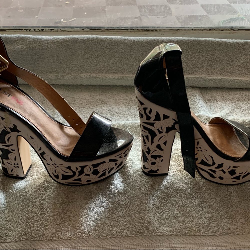 White and black heals.  Worn once size 6.